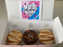 Load image into Gallery viewer, Box of fudge bonbons with a 'Happy Valentine's Day' card on a reflective surface