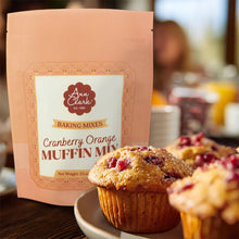 Load image into Gallery viewer, Packaging of Ann Clark Cranberry Orange Muffin Mix with muffins on a table