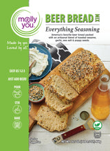 Load image into Gallery viewer, Molly You Beer Bread seasoning mix packaging with bread and ingredients on a wooden board.