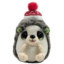 Load image into Gallery viewer, A plush hedgehog toy with a gray and cream body, large glossy black eyes, green inner ears, and a red-and-white knit hat with a red pom-pom on top, shown on a plain white background.