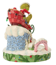 Load image into Gallery viewer, Decorative figurine with a character in a red outfit and hat, standing on a cloud-like base with text.