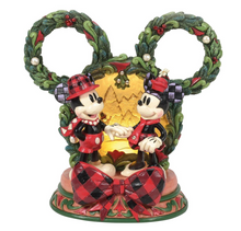 Load image into Gallery viewer, 
Disney's Mickey and Minnie Mouse figures in festive attire with a wreath and bow on a white background . LED. Artist Jim Shore.