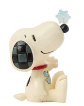 Load image into Gallery viewer, A stylized figurine of Snoopy sitting down, with his mouth wide open showing a black-and-white checkered interior. He wears a red collar and a light blue flower on his nose, set against a plain white background.