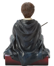 Load image into Gallery viewer, Figurine of a Harry Potter in a gray robe with a wand, sitting on a decorative base.Artist Jim Shore.