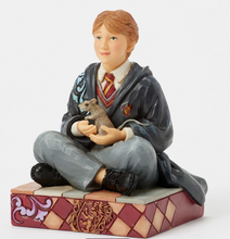 Load image into Gallery viewer, Figurine of a Ron from Harry Potter  in a school uniform holding a Skabbers the rat on a decorative base.