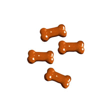 Load image into Gallery viewer, Four orange bone-shaped treats on a white background