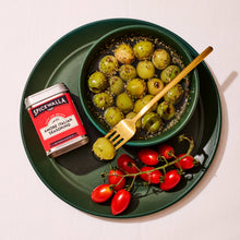 Load image into Gallery viewer, Spicewalla seasoning jar with green and red grapes on a green plate