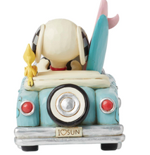 Load image into Gallery viewer, Sculpture of a dog in a car with a surfboard on a white background