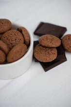 Load image into Gallery viewer, Chocolate cookies in a white bowl on a light gray background