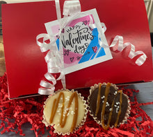 Load image into Gallery viewer, Valentine's Day gift with red box, white ribbon, and two chocolate cups on red shredded paper.