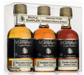 Three bottles of Mount Mansfield Maple Products maple syrup in a clear packaging box.