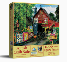 Load image into Gallery viewer, Jigsaw puzzle box featuring a red barn, quilted wagon, and horse with 'Amish Quilt Sale' text.

Details
