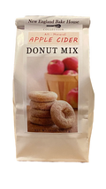 Package of New England Bake House Apple Cider Donut Mix with donuts and apples on the label.