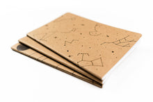 Load image into Gallery viewer, Two brown notebooks with star constellation designs on a white background
