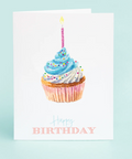 Birthday card with a cupcake and candle on a light blue background