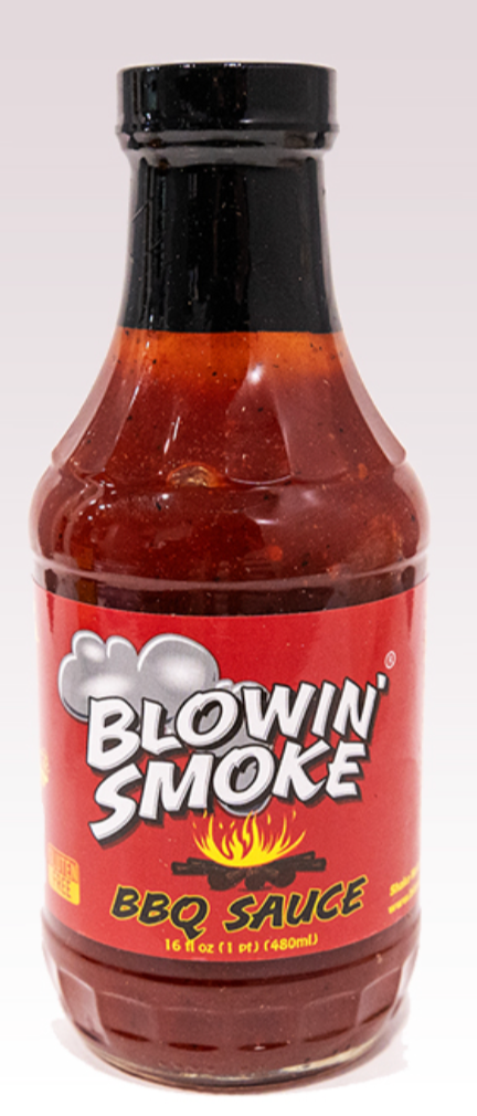 A bottle of Blowin' Smoke BBQ Sauce with a red label and black cap, photographed against a plain light background.