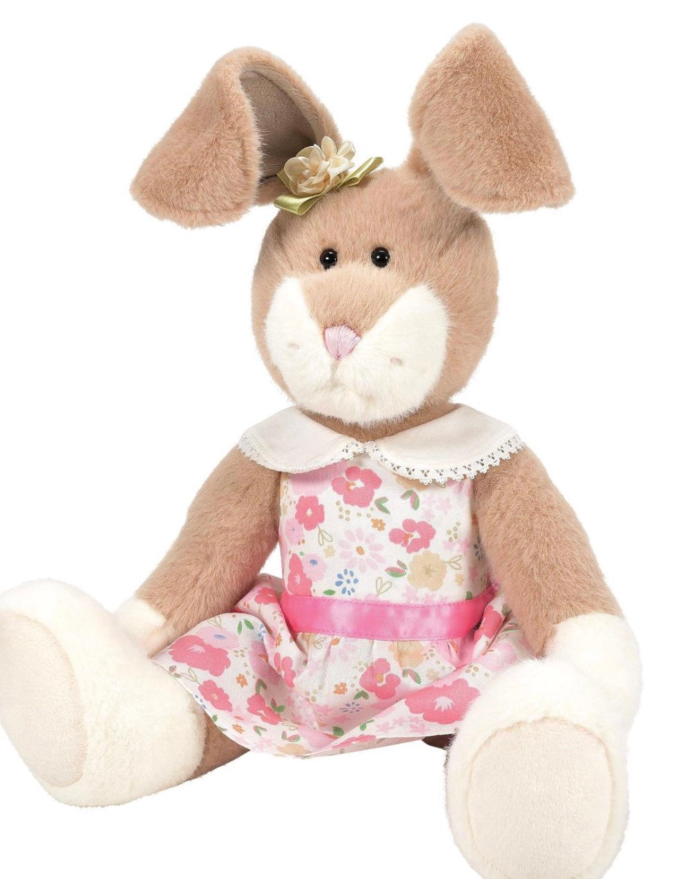 


Plush toy rabbit wearing a floral dress on a white background