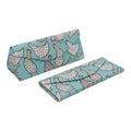 Two folded fabric panels with chicken pattern on a white background