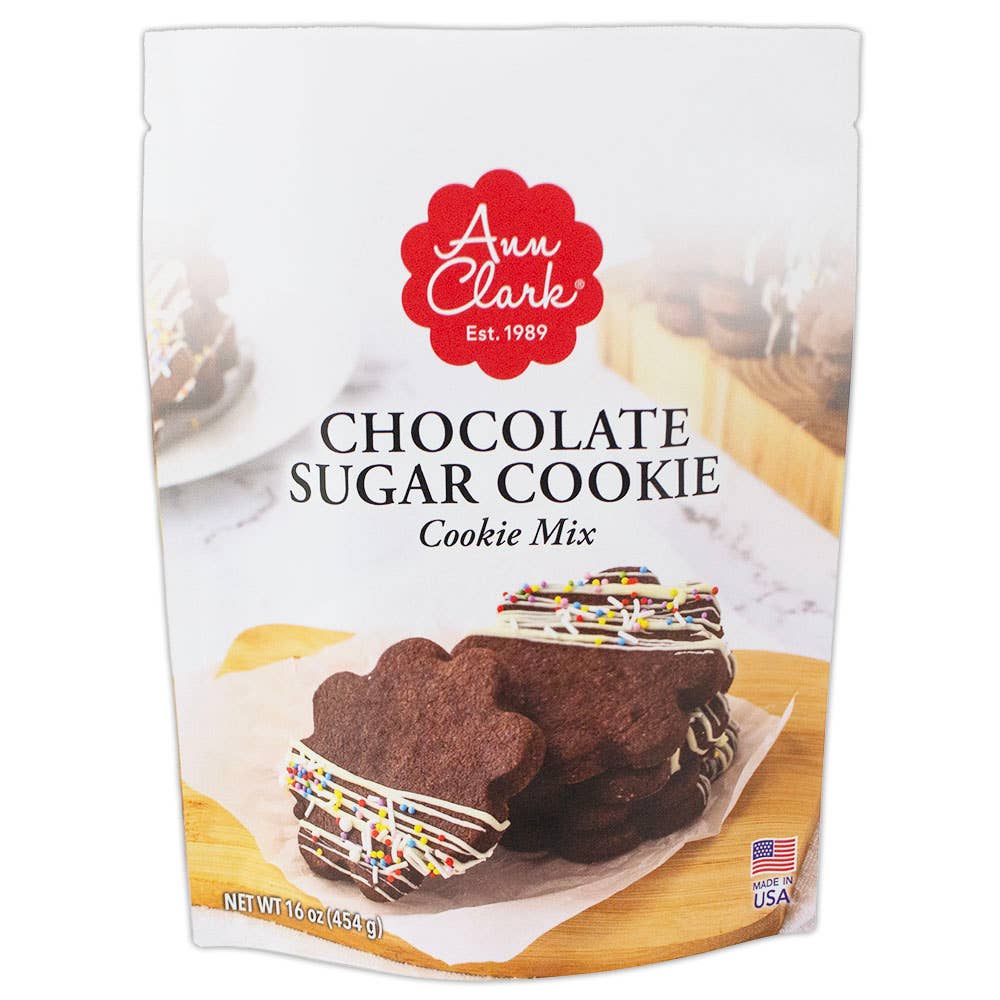 Packaging of Ann Clark chocolate sugar cookie mix with cookies on a wooden board.