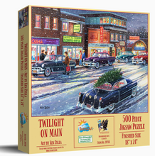 Load image into Gallery viewer, Jigsaw puzzle box featuring a snowy town scene with cars and buildings.
