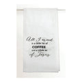 White towel with black text 'All I need is a little bit of coffee and a whole lot of Jesus' on a white background