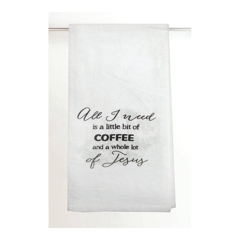White towel with black text 'All I need is a little bit of coffee and a whole lot of Jesus' on a white background