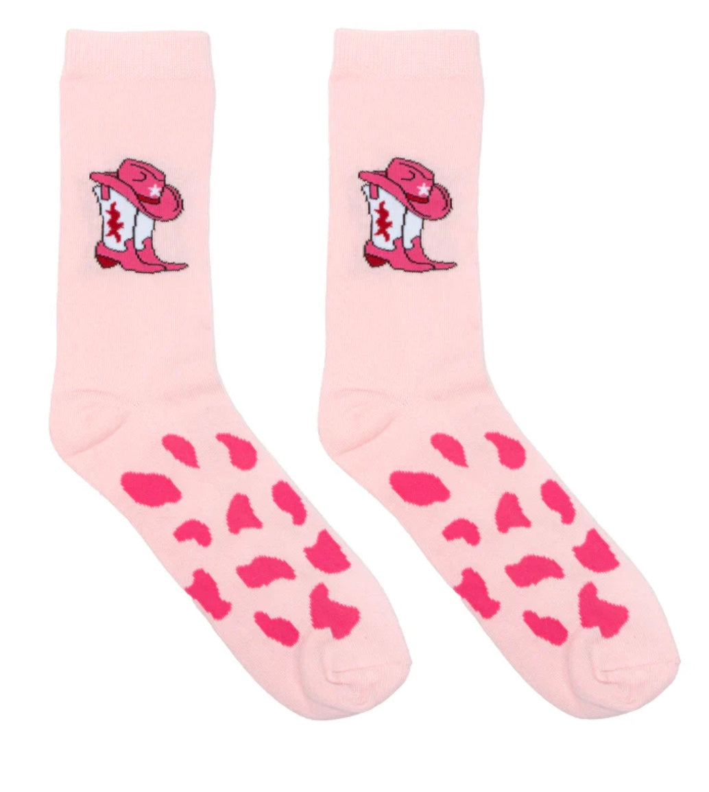 Pink socks with cowboy boot and hat design on a white background