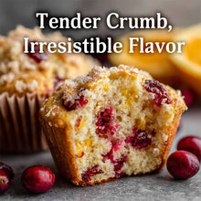 Load image into Gallery viewer, Cranberry muffin with visible crumb texture, surrounded by cranberries on a gray surface.
