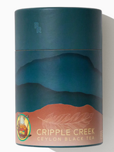 Load image into Gallery viewer, Tea canister with 'Cripple Creek' branding and landscape design on a white background

