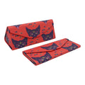 Red clutch bag with cat pattern on a white background