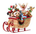 Animated character figurines in a sleigh on a white background