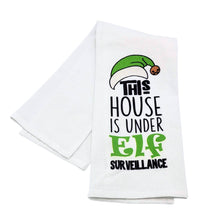 Load image into Gallery viewer, White towel with Christmas-themed text and graphic on a white background
