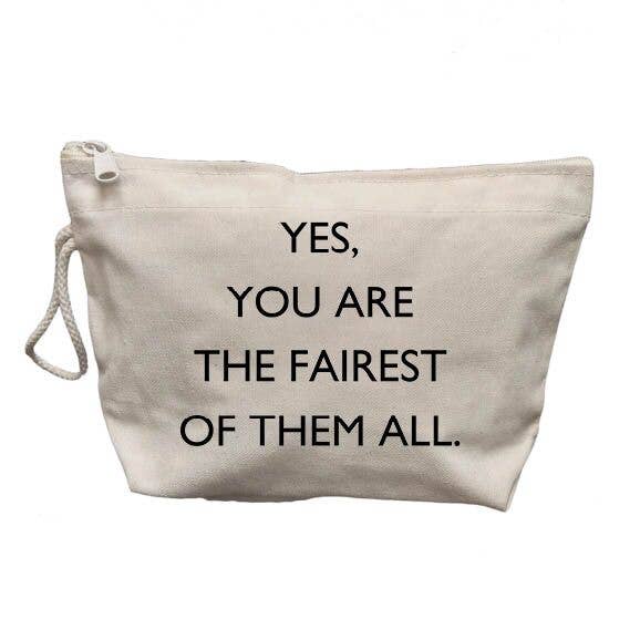 A light beige canvas pouch with a white zipper and a white rope handle, featuring the printed text 'YES, YOU ARE THE FAIREST OF THEM ALL.' in black capital letters, shown against a plain white background.