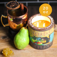 Load image into Gallery viewer, Candle labeled 'Honeypears' with a pear and mug on a wooden surface
