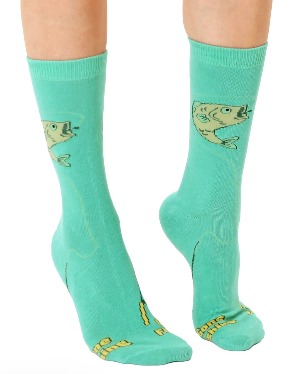 Teal socks with fish design worn by a person on a white background

