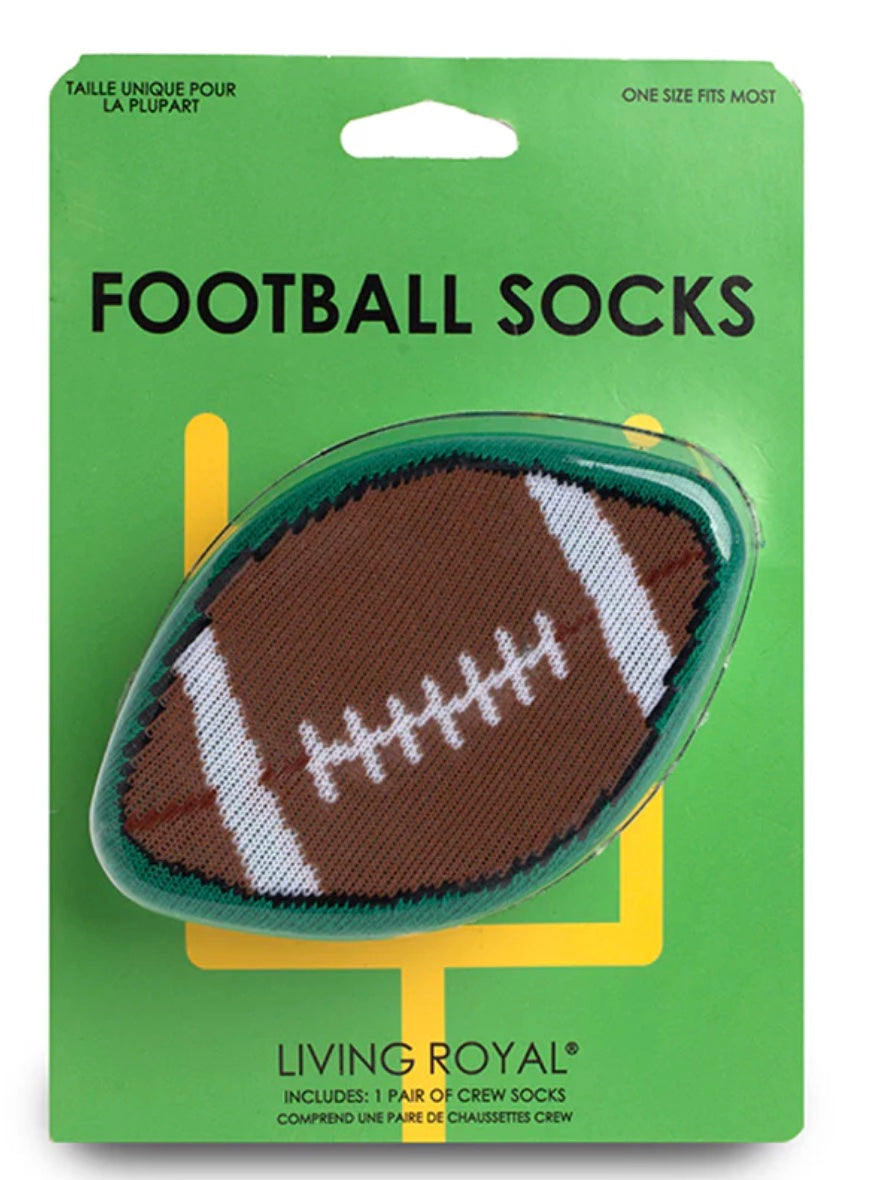 Packaging of Living Royal football socks with a green background