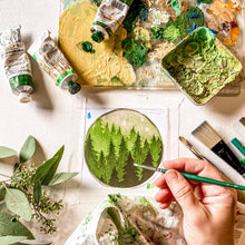 Load image into Gallery viewer, Artistic process of painting a forest scene with green paint on a textured surface.
