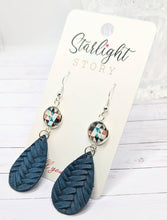 Load image into Gallery viewer, Blue woven teardrop earrings with floral accents on a 'Starlight Story' branded card.
