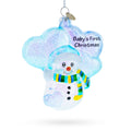 Glass snowman ornament with 'Baby's First Christmas' text on a white background