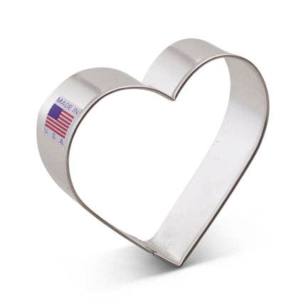 Heart-shaped metal cookie cutter with 'Made in USA' label on a white background