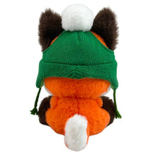 Load image into Gallery viewer, A plush toy fox viewed from the back, wearing a green knit hat with ear flaps, a white pom-pom, and green drawstrings, on a plain white background.
