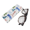 Eyeglasses with a colorful case featuring cat illustrations on a white background