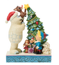 Christmas-themed figurine with a bear, reindeer, and other characters around a decorated tree.