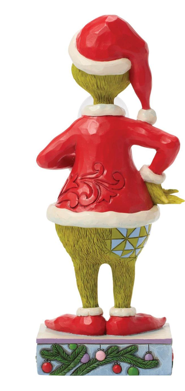 Elf figurine with red jacket and green pants on a white background