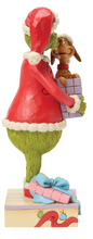 Load image into Gallery viewer, Animated character in a red outfit with a dog holding a gift, on a white background
