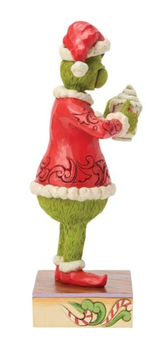Figurine of a character in a red outfit with green pants and a white beard, holding a candy cane.