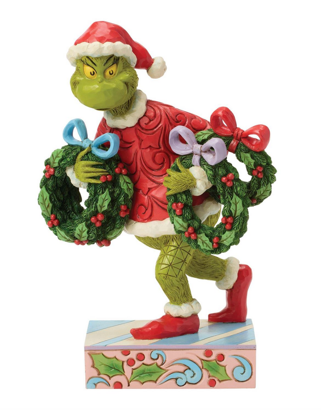 Figurine of a character holding Christmas wreaths with a white background