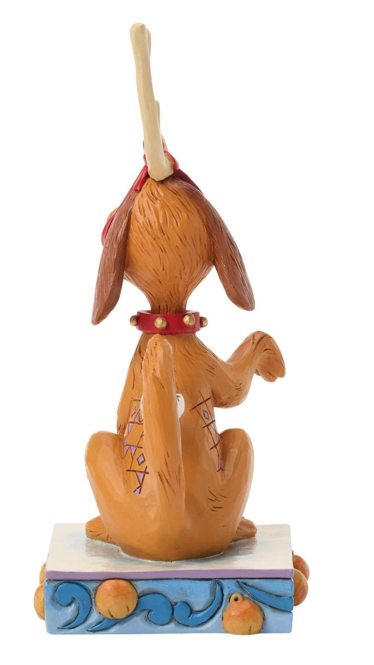 Dog figurine with a baseball bat on a white background