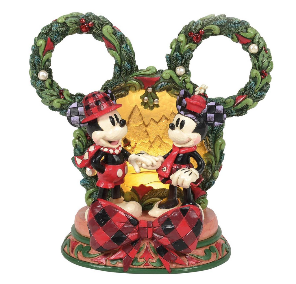 

Disney's Mickey and Minnie Mouse figures in festive attire with a wreath and bow on a white background . LED. Artist Jim Shore.
