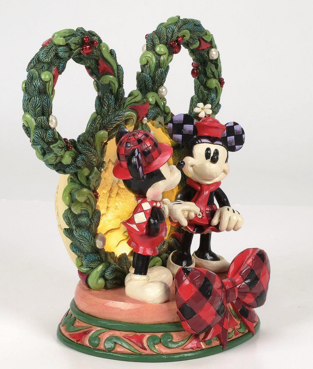 Decorative figurine of Disney's Mickey and Minnie Mouse with Christmas wreath on a white background. LED. Artist Jim Shore.